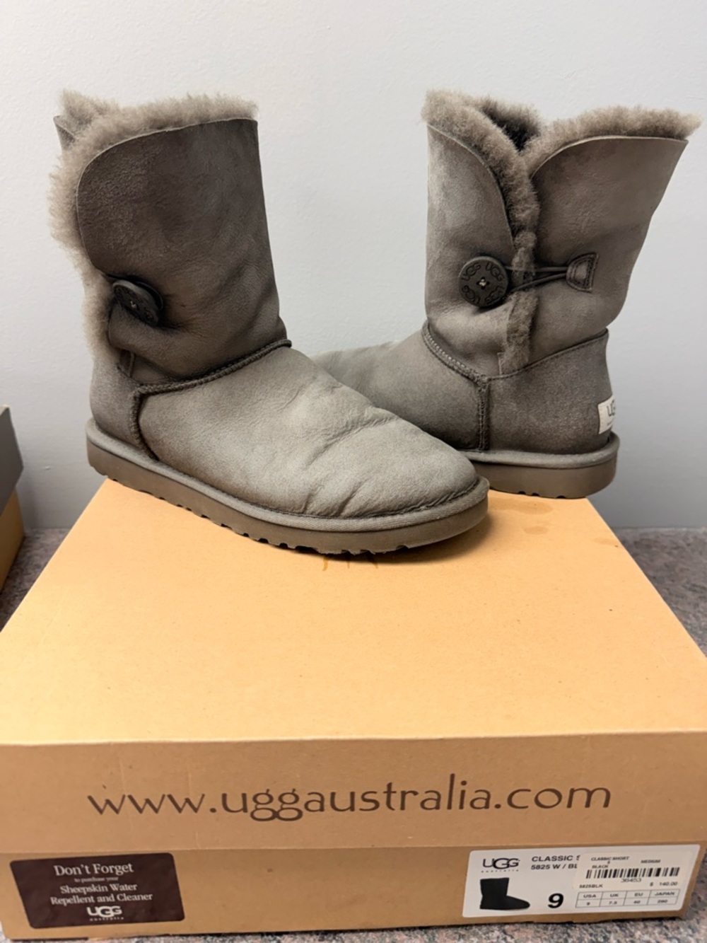 UGG Classic Short Button Shearling Boots in Grey